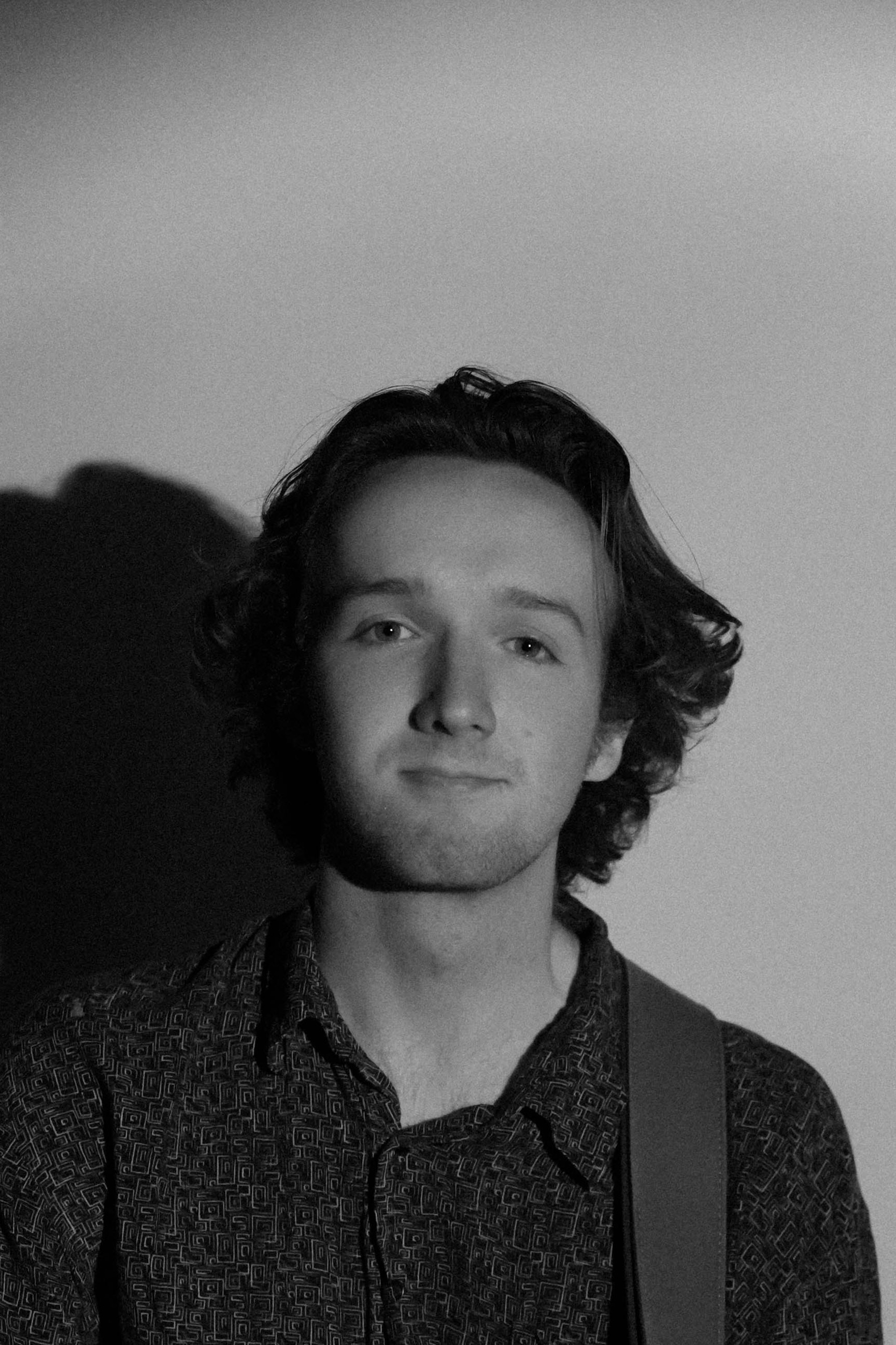 Portrait of Isaac Hermanson, bass player for Abunto.